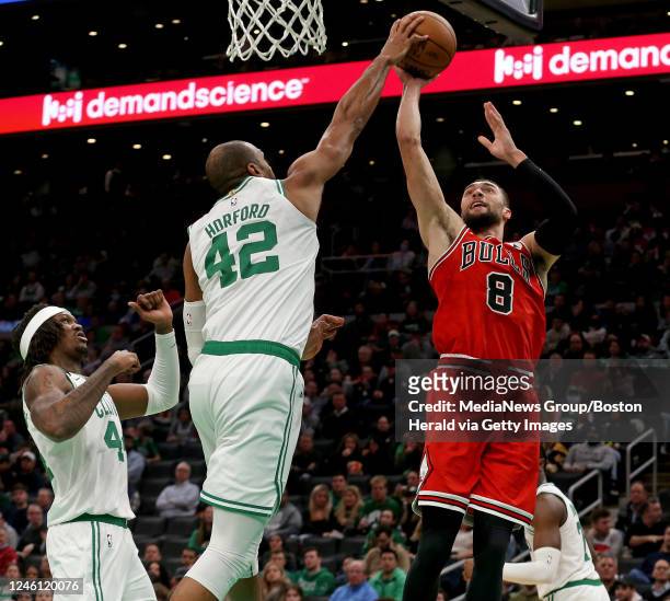 January 9: Al Horford of the Boston Celtics blocks Zach LaVine of the Chicago Bulls shot as Robert Williams III looks on during the second half of...