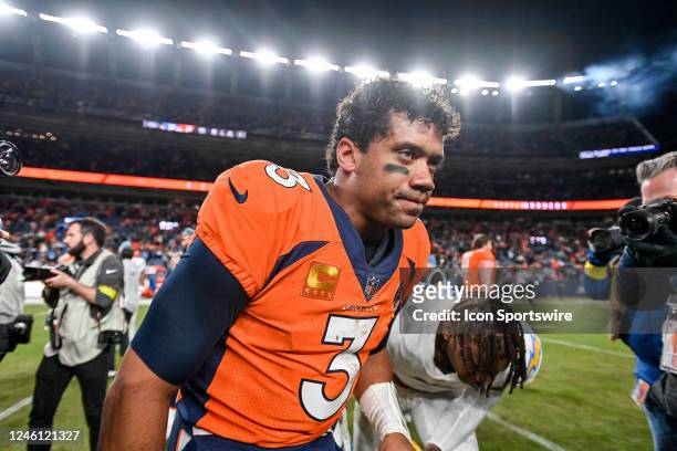 Denver Broncos quarterback Russell Wilson on the field after a win against the Los Angeles Chargers after a game at Empower Field at Mile High on...