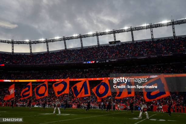 Flags are run accross the field to celebrate a Denver Broncos touchdown in a general view from the field level during a game between the Los Angeles...