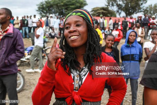 Reveler enjoys performances during a reggae concert to commemorate Nakuru's inclusion in the UNESCO Creative Cities Network as a city of culture and...