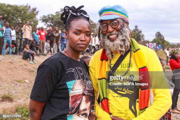Reggae fan poses for a picture with Barbushe Maina , The Nakuru UNESCO Creative City alternative contact looks on during a reggae concert to...