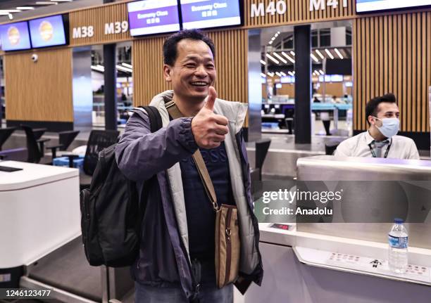 Passenger checks-in before the first flight from Istanbul to Guangzhou as China re-opens its borders for the first time since March 2020 due to...