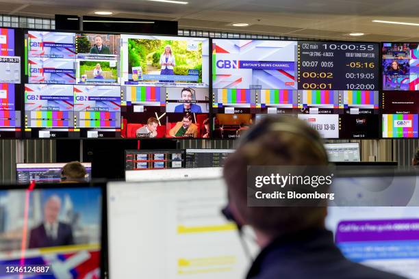 Employees work at live production desks in the newsroom of the GB News television studio in London, UK, on Thursday, Dec. 8, 2022. The startup has...