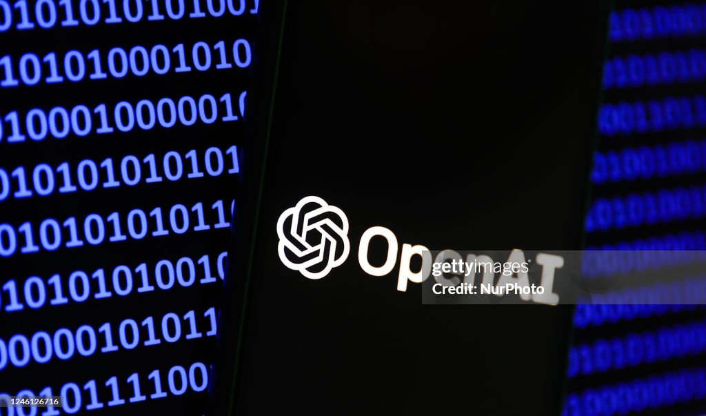 OpenAI logo displayed on a phone screen and a binary code displayed ...