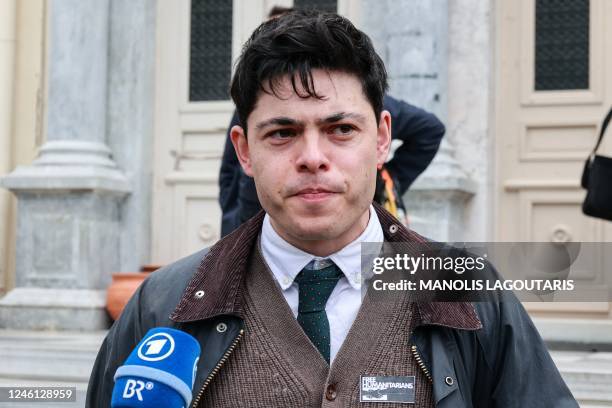 Rescue worker German-Irish Sean Binder, a co-accused, talks to media outside a court in Mytilene on January 10, 2023. - A trial in Greece of 24...