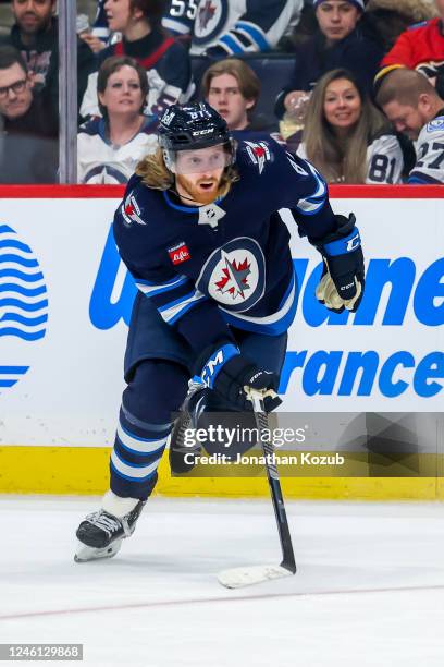 Kyle Connor of the Winnipeg Jets skates during second period action against the Calgary Flames at Canada Life Centre on January 03, 2023 in Winnipeg,...