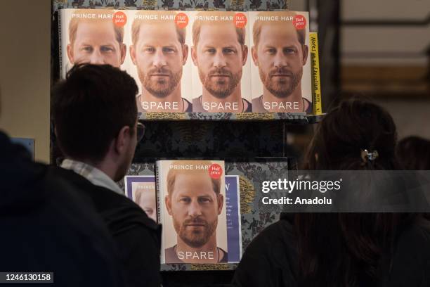 Customers look at copies of Prince Harry's memoir 'Spare' at a bookshop in central London on the day of its official release in London, United...