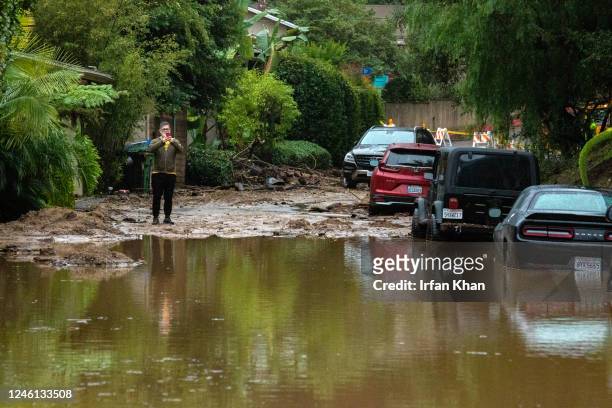 Studio City, CA A resident takes a look at mudslide and flooded street closure at 3700 block of North Fredonia Drive on Tuesday, Jan. 10, 2023 in...