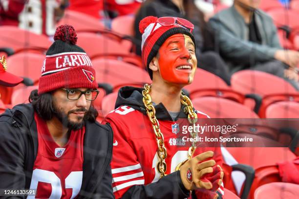 Two friendly team rival fans waiting for the start of the Week 18 game between the Arizona Cardinals and the San Francisco 49ers on Sunday, January...