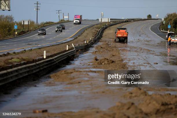 Caltrans removes mud and debris washed up along US 101 northbound lane on Tuesday, Jan. 10, 2023 in Ventura, CA. US 101 was closed to the public in...