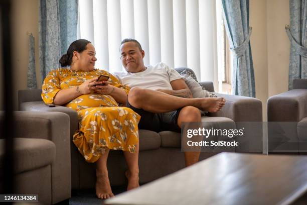 young couple at home - pacific islanders stock pictures, royalty-free photos & images
