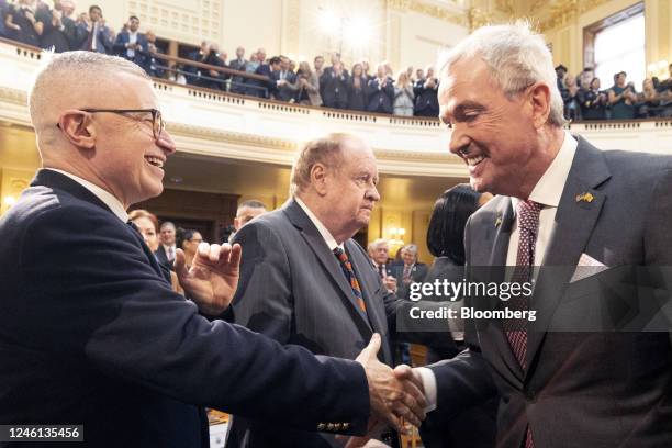 Phil Murphy, governor of New Jersey, right, shakes hands with Jim McGreevey, former governor of New Jersey, during the 2023 State of the State...