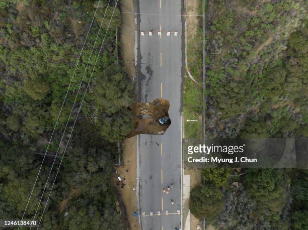 Two vehicles fell into a sinkhole on Iverson Road in Chatsworth trapping four people. Photographed at Iverson Road on Tuesday, Jan. 10, 2023 in...
