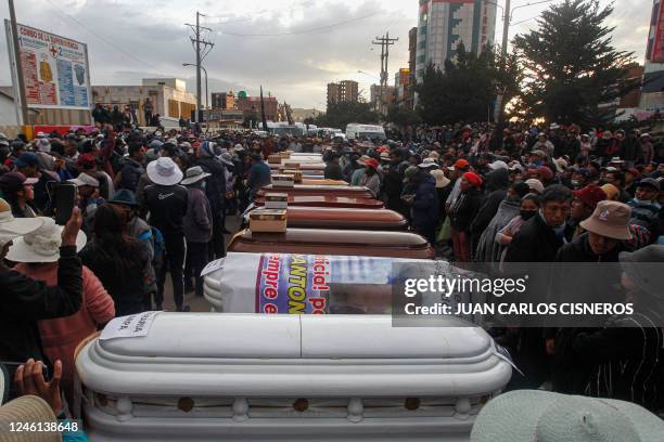 Relatives of the victims of the clashes with the Peruvian police wait with empty coffins outside the morgue of the Carlos Monge Medrano hospital in...