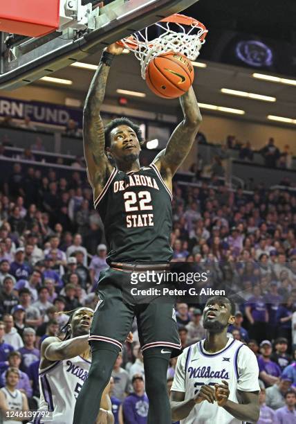 Kalib Boone of the Oklahoma State Cowboys dunks the ball in the first half against the Kansas State Wildcats at Bramlage Coliseum on January 10, 2023...