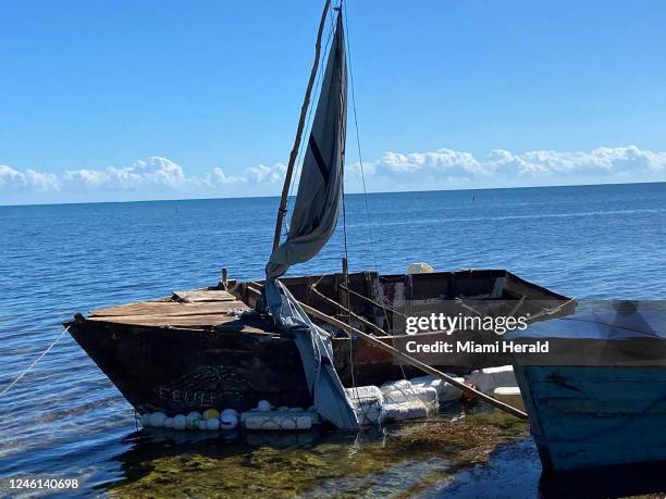 Steel-hulled, makeshift migrant sailboat is grounded near the mangroves of Harry Harris Park in the Upper Keys area of Tavernier on Tuesday, Jan. 10,...