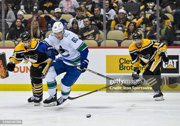 Vancouver Canucks Left Wing Ilya Mikheyev goes for the puck as Pittsburgh Penguins Defenseman Jan Rutta defends during the second period in the NHL...