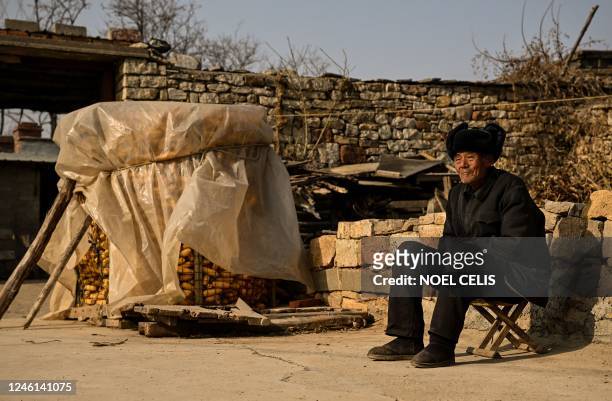 This photo taken on January 7, 2023 shows an elderly man in a rural area in Tai'an, China's eastern Shandong province. - Since Beijing reversed its...
