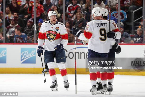 Carter Verhaeghe, Brandon Montour and Sam Bennett of the Florida Panthers celebrate a goal against the Colorado Avalanche at Ball Arena on January...
