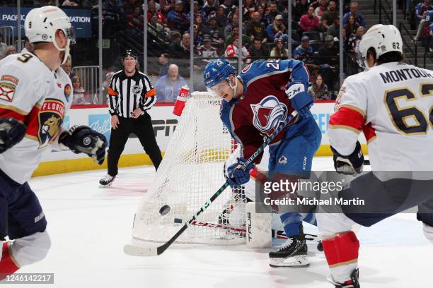 Logan O'Connor of the Colorado Avalanche reaches for a loose puck in the first period against the Florida Panthers at Ball Arena on January 10, 2023...