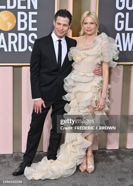 Actress Michelle Williams and director Thomas Kail arrive for the 80th annual Golden Globe Awards at The Beverly Hilton hotel in Beverly Hills,...