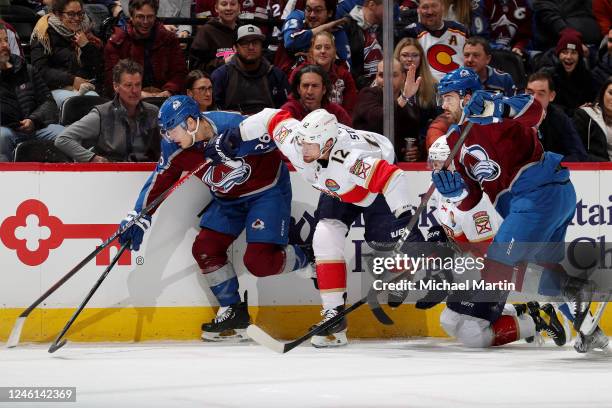 Eric Staal of the Florida Panthers skates against Jacob MacDonald and Martin Kaut of the Colorado Avalanche at Ball Arena on January 10, 2023 in...