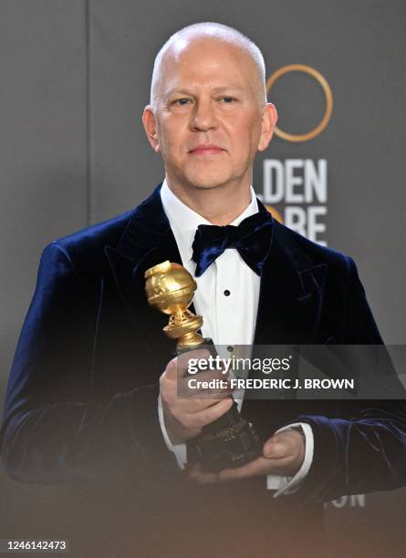 Television writer and honoree Ryan Murphy poses with the Carol Burnett Award in the press room during the 80th annual Golden Globe Awards at The...