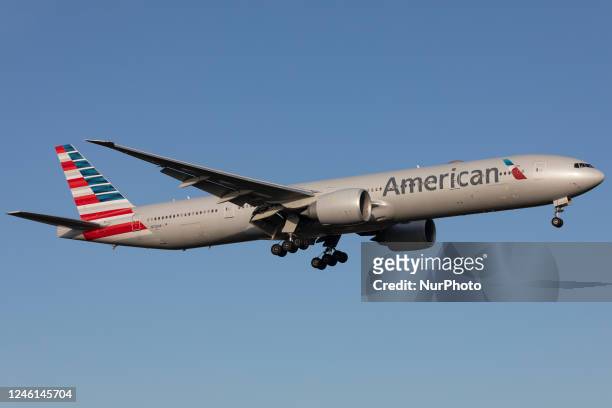 An American Airlines Boeing 777 landing at London Heathrow Airport, Hounslow, United Kingdom Wednesday 14th December 2022.