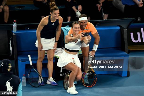 Marta Kostyuk of Ukraine takes a selfie with Spain's Rafael Nadal and Maria Sakkari of Greece during a Tennis Plays for Peace charity event ahead of...