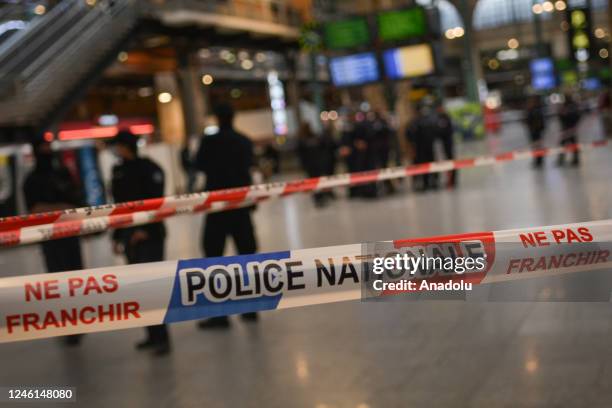 French police cordon off an area at Paris' Gare du Nord train station, after a knife-wielding suspect injured six people, including a police officer,...