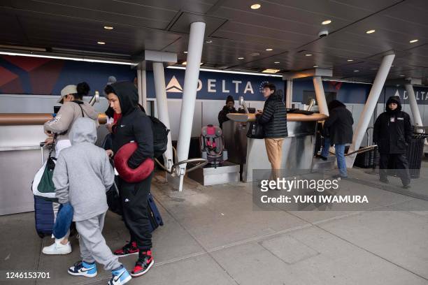 Travelers arrive at John F. Kennedy International Airport on January 11 in New York. - The US Federal Aviation Authority said Wednesday that normal...