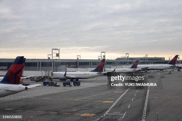 Grounded Delta Airlines planes are parked at gates at John F. Kennedy International Airport on January 11 in New York. - The US Federal Aviation...