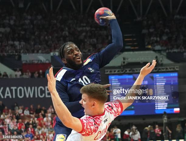 France's right back Dika Mem jumps to shoot past Poland's left back Ariel Pietrasik during the Men's IHF World Handball Championship Group B match...