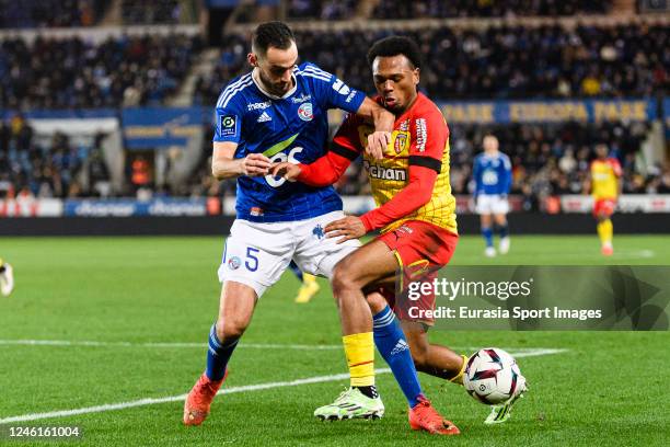 Lucas Perrin of RC Strasbourg battles for the ball with Lois Openda of Lens during the Ligue 1 match between RC Strasbourg and RC Lens at Stade de la...