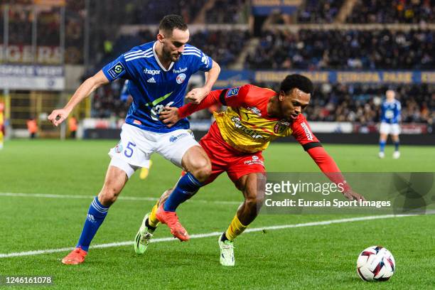 Lucas Perrin of RC Strasbourg battles for the ball with Lois Openda of Lens during the Ligue 1 match between RC Strasbourg and RC Lens at Stade de la...