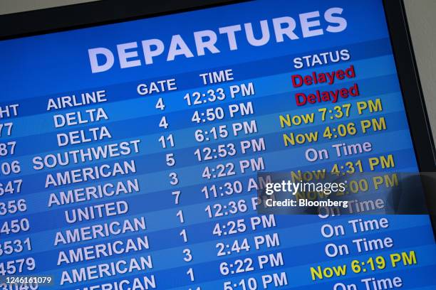 Delayed flights on a departure board after the Federal Aviation Administration lifted a ground stop at Bill and Hillary Clinton National Airport in...