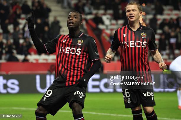 Nice's Ivorian forward Nicolas Pepe celebrates with Nice's French defender Melvin Bard after scoring his team's third goal during the French L1...