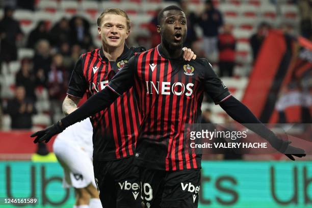 Nice's Ivorian forward Nicolas Pepe celebrates with Nice's French defender Melvin Bard after scoring his team's third goal during the French L1...