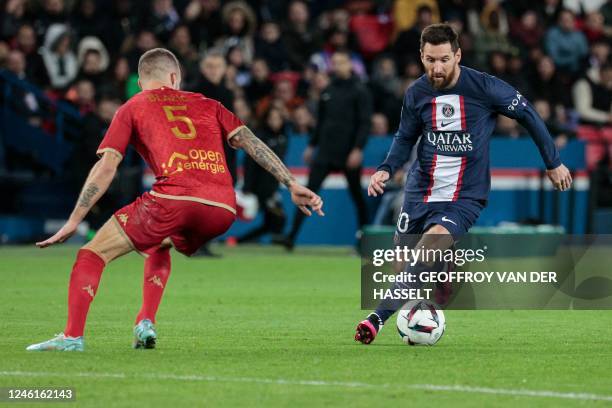 Paris Saint-Germain's Argentine forward Lionel Messi fights for the ball with Angers' Slovenian defender Miha Blazic during the French L1 football...