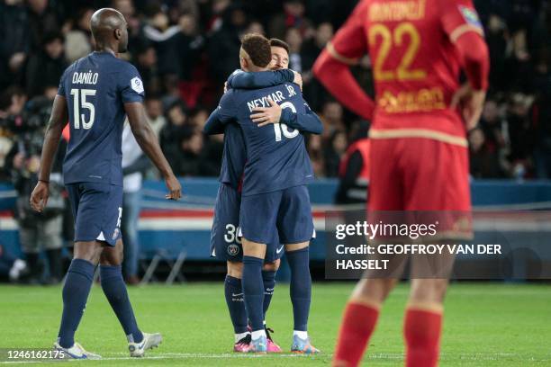 Paris Saint-Germain's Argentine forward Lionel Messi celebrates with Paris Saint-Germain's Brazilian forward Neymar after scoring his team's second...