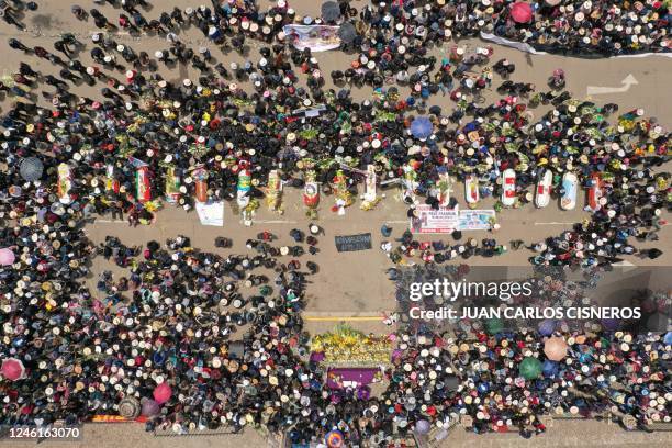 Aerial view of relatives and friends of the victims of clashes with the Peruvian police puting their coffins in the main plaza of the Andean city of...