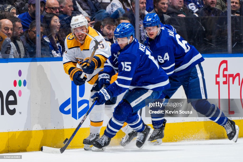Toronto Predators Alexander Kerfoot of the Toronto Maple Leafs battles for the puck ...