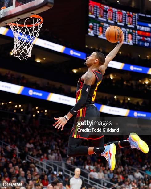 Dejounte Murray of the Atlanta Hawks goes up for a dunk during the first half against the Milwaukee Bucks at State Farm Arena on January 11, 2023 in...