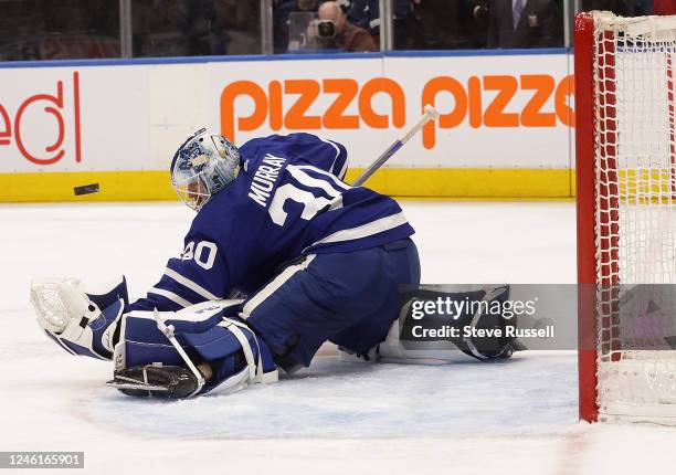 The puck bounces off Toronto Maple Leafs goaltender Matt Murray glove as he makes a save as the Toronto Maple Leafs play the Nashville Predators at...