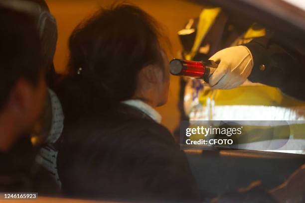 Traffic police carry out night checks on key roads under their jurisdiction in Zhoushan City, Zhejiang province, Jan. 11, 2023. The Spring Festival...