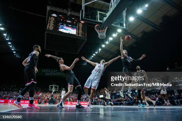 Tomer Ginat of Hapoel Tel Aviv and Luke Nelson, Tomislav Zubi, Sam Dekker of London Lions in action during the EuroCup match between London Lions and...