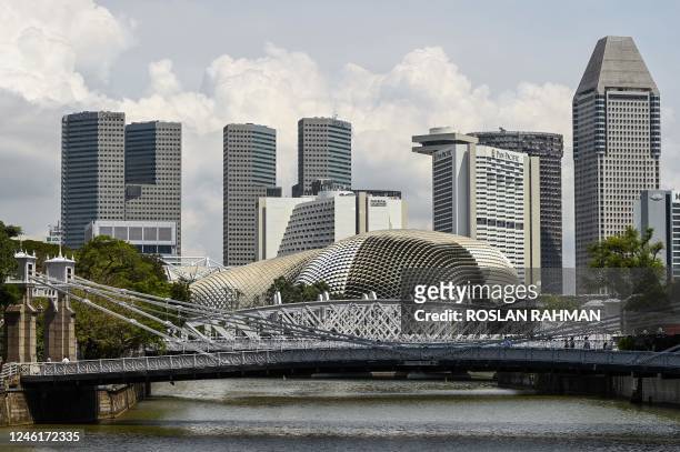 Cavenagh Bridge is pictured opposite the Raffles Place financial business district in Singapore on January 12, 2023.