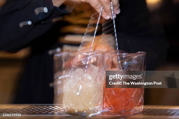 Andra AJ Johnson, managing partner and beverage director of Serenata bar, prepares mocktails on January 7, 2023 in Washington, DC. For the...