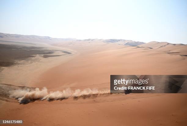 French driver Sebastien Loeb and Belgian co-driver Fabian Lurquin steer their BRX during the Stage 11 of the Dakar 2023, between Shaybah and Empty...