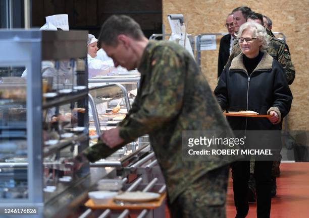 German Defence Minister Christine Lambrecht queues with soldiers of the German armed forces Bundeswehr as she has lunch in the canteen during her...